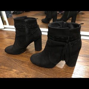 Black booties with fringe